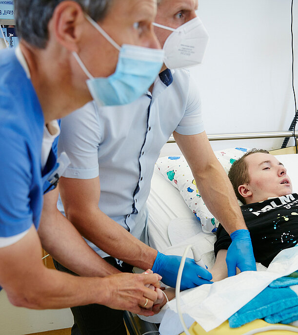  Picture: A patient being treated with botulinum toxin by two doctors