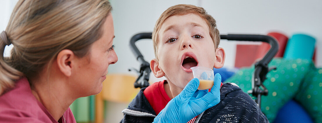 Picture: The speech therapist is practising the swallowing and chewing function on a patient.